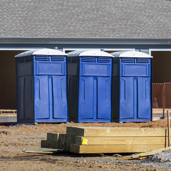 what is the maximum capacity for a single portable toilet in Godfrey